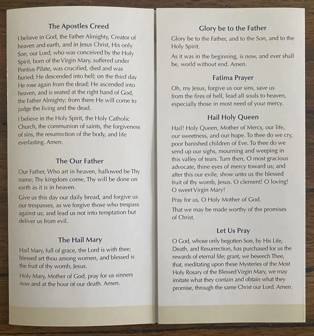 A Rosary Pamphlet with the words of the rosary on it.