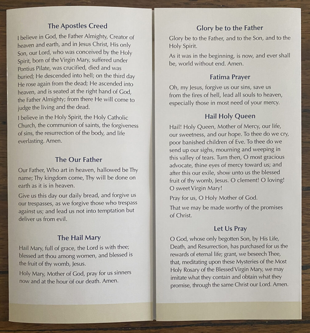 A Rosary Pamphlet with the words of the rosary on it.